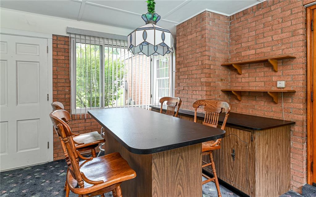 121 Oakglen Road Pittsburgh, PA 15237 - Photo 8 of 30 a view of a dining room with furniture and a chandelier