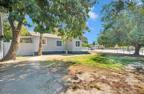 a view of street with large trees
