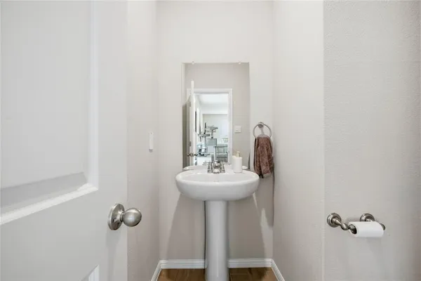a bathroom with a sink a mirror and shower