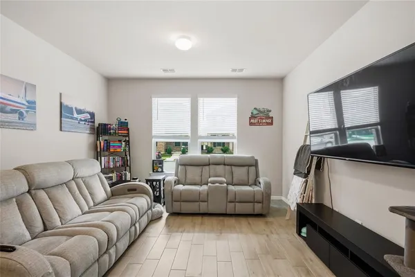a bedroom with furniture and a window
