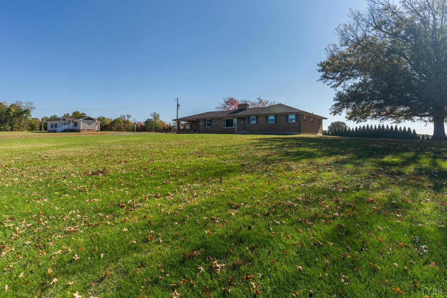5461 Red House Road Rustburg, VA 24588 - Photo 2 of 47 a view of a house with a yard and a fountain