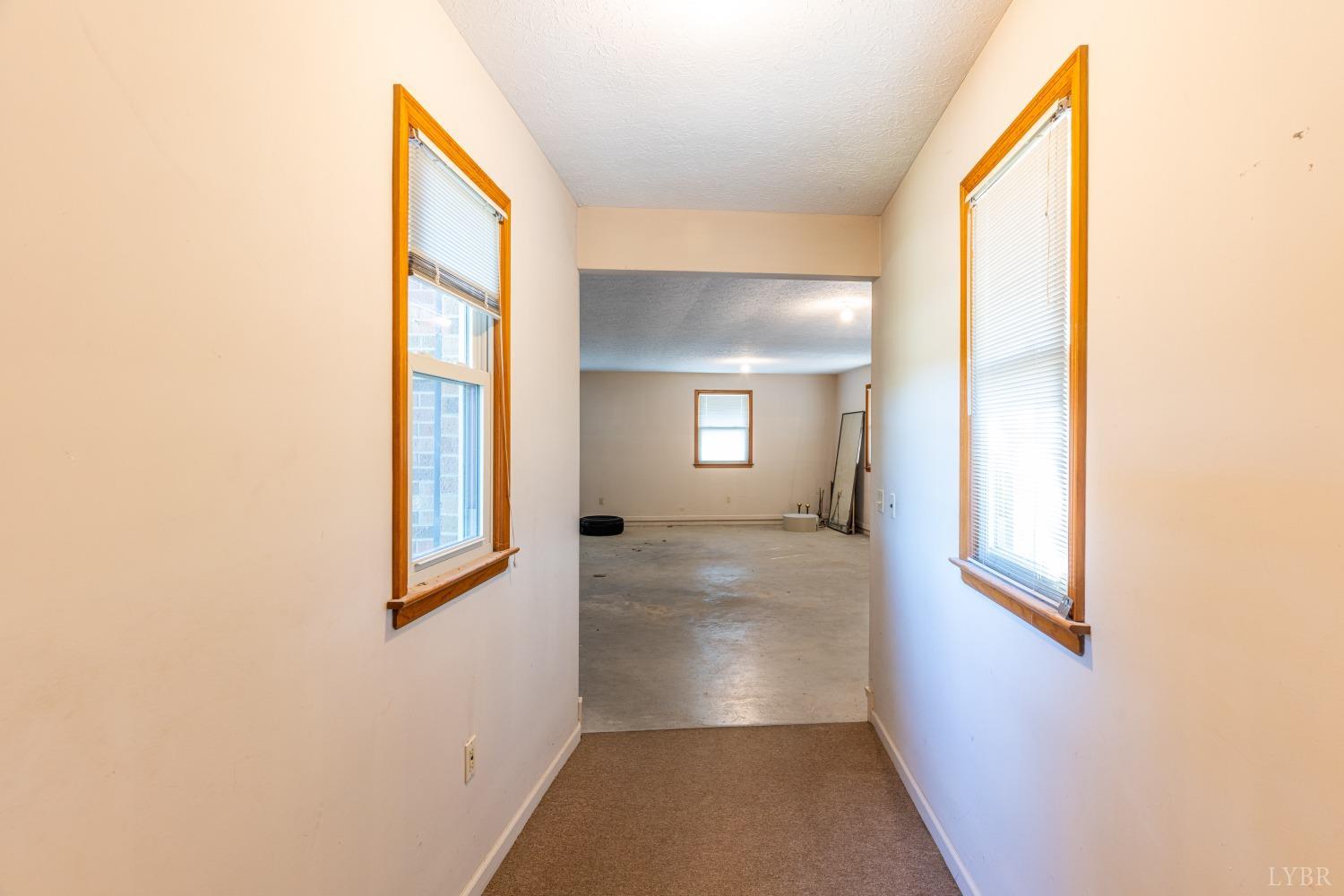 5461 Red House Road Rustburg, VA 24588 - Photo 22 of 47 a view of a hallway with windows