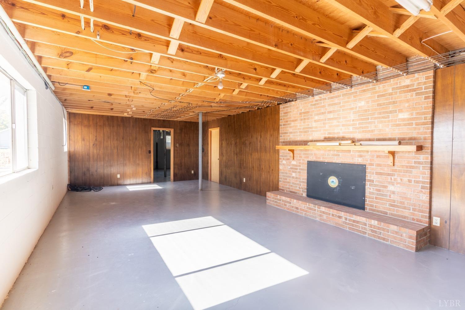 5461 Red House Road Rustburg, VA 24588 - Photo 25 of 47 a view of a livingroom with a fireplace and window