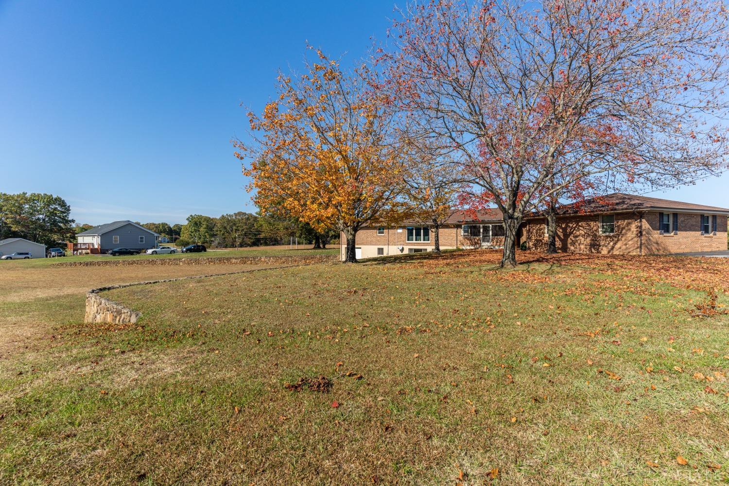 5461 Red House Road Rustburg, VA 24588 - Photo 38 of 47 a front view of a building with large trees