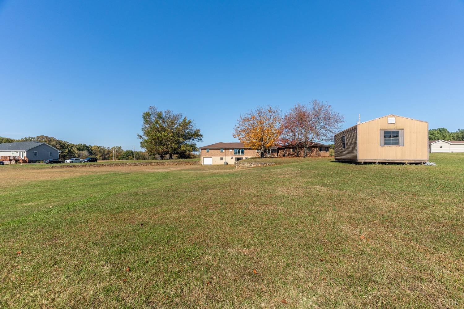 5461 Red House Road Rustburg, VA 24588 - Photo 40 of 47 a view of a big yard with an outdoor space