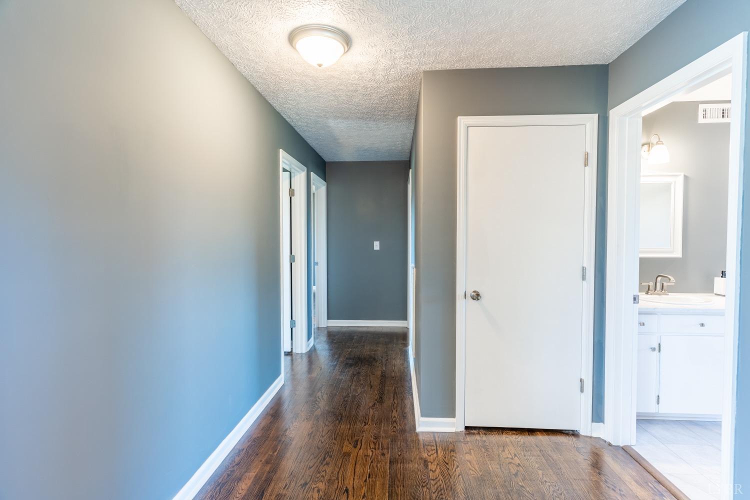 5461 Red House Road Rustburg, VA 24588 - Photo 6 of 47 a view of a hallway with wooden floor