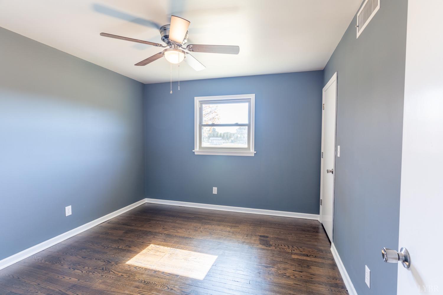 5461 Red House Road Rustburg, VA 24588 - Photo 8 of 47 wooden floor in an empty room with a window