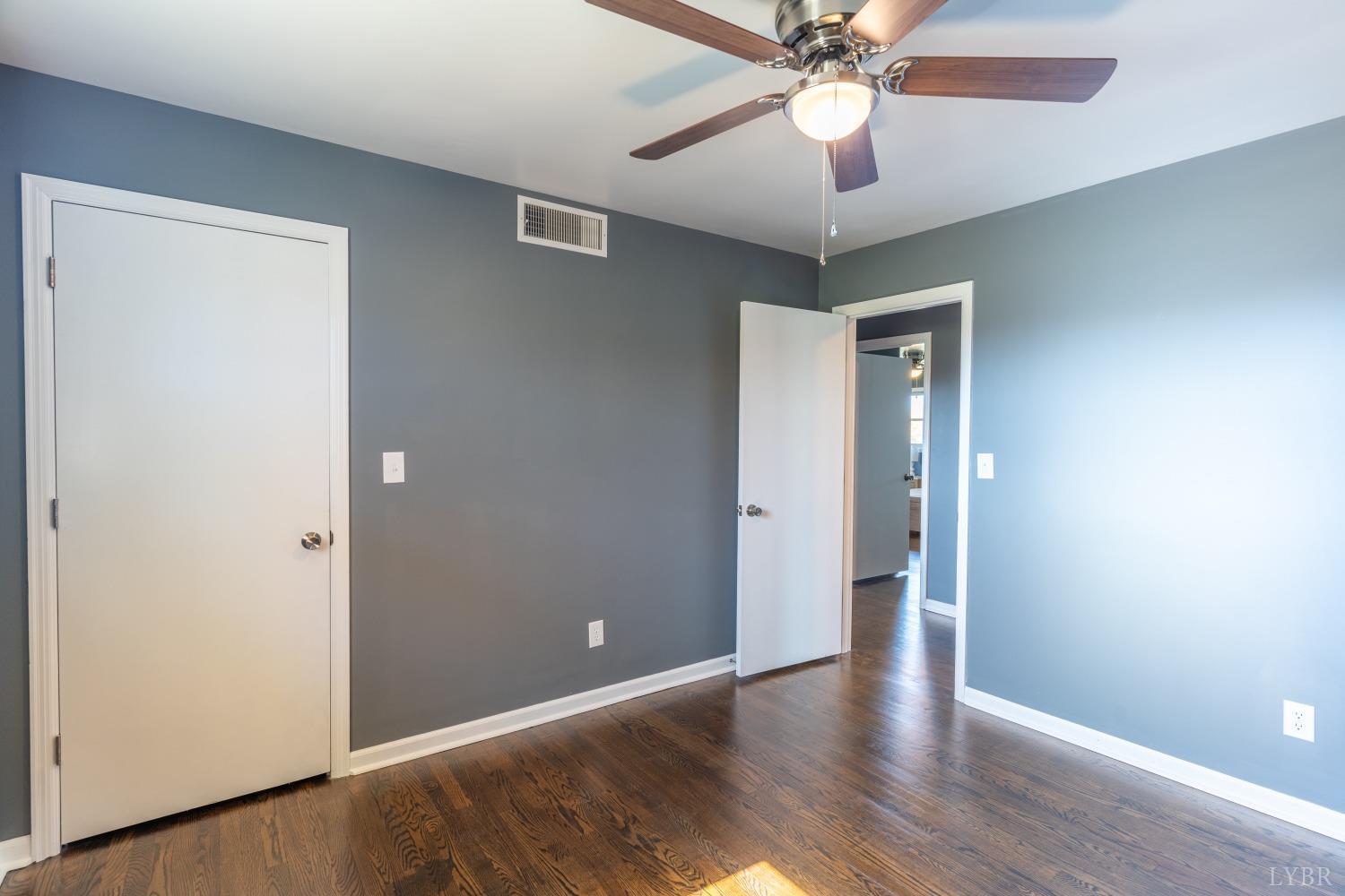 5461 Red House Road Rustburg, VA 24588 - Photo 9 of 47 a view of an empty room with a chandelier fan