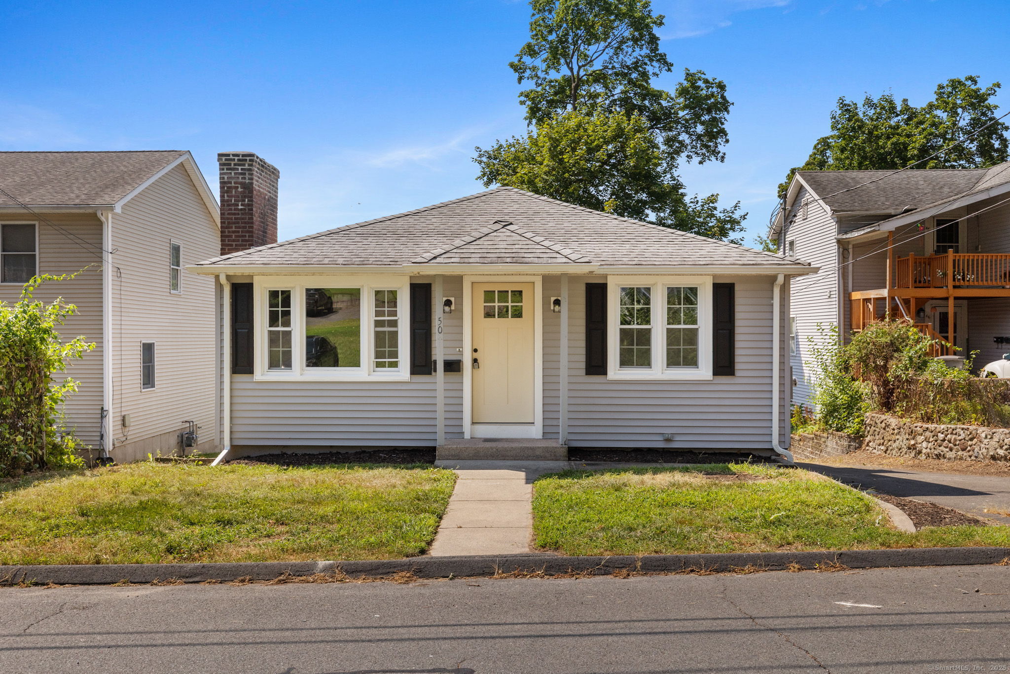 a front view of a house with garage