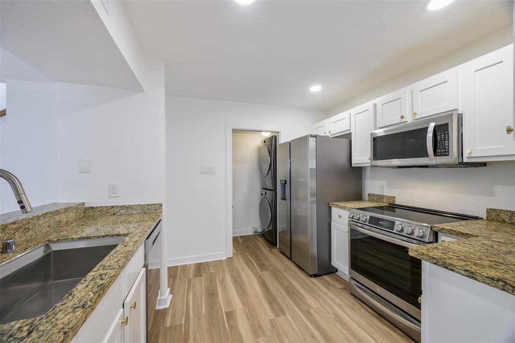 4777 Cedar Springs Road, Unit 7P Dallas, TX 75219 - Photo 5 of 21 a kitchen with a stove and a microwave