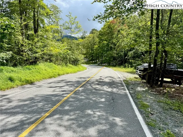 a view of a street with sitting area
