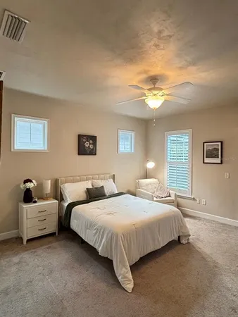 a bedroom with double bed and a lamp