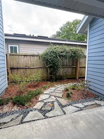a backyard of a house with a yard and garage