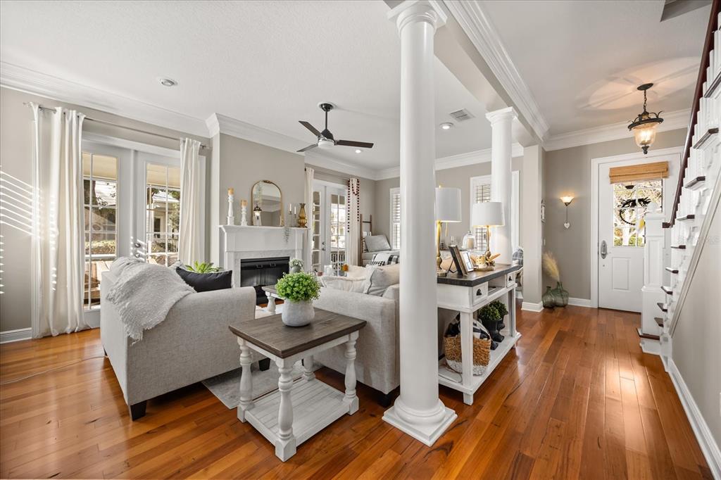 815 Spring Park Loop Celebration, FL 34747 - Photo 13 of 51 a living room with furniture and a wooden floor