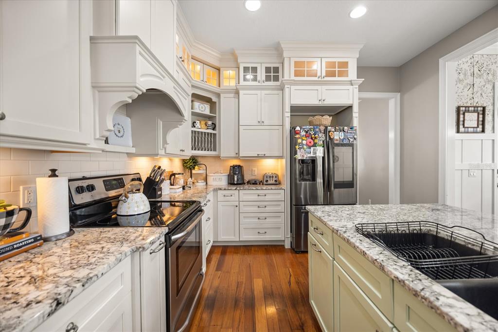 815 Spring Park Loop Celebration, FL 34747 - Photo 15 of 51 a kitchen with a stove oven and sink
