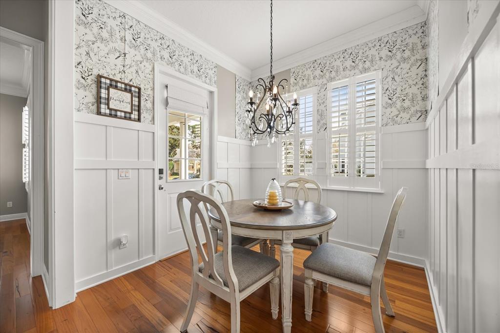 815 Spring Park Loop Celebration, FL 34747 - Photo 17 of 51 a view of a dining room with furniture and chandelier