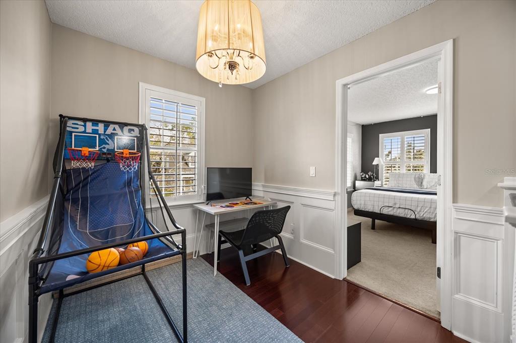 815 Spring Park Loop Celebration, FL 34747 - Photo 22 of 51 a view of a workspace with furniture and a window