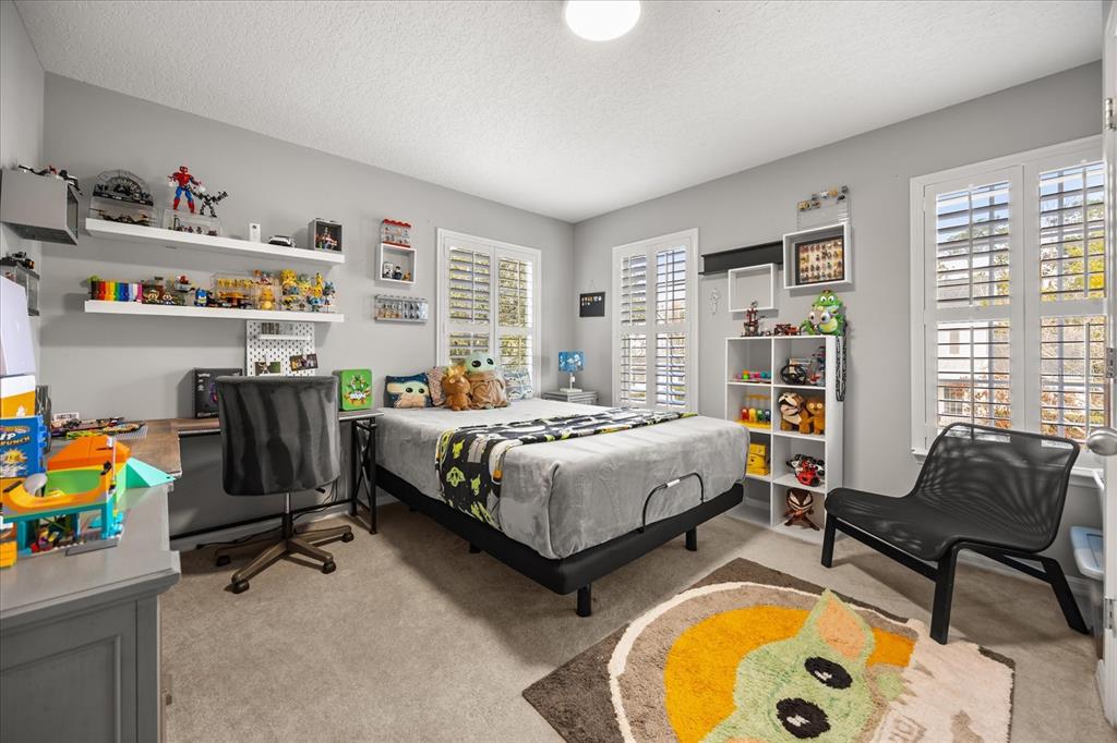 815 Spring Park Loop Celebration, FL 34747 - Photo 24 of 51 a bedroom with a bed and a couch