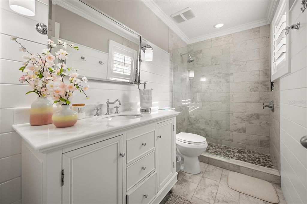 815 Spring Park Loop Celebration, FL 34747 - Photo 27 of 51 a bathroom with a sink a toilet and shower