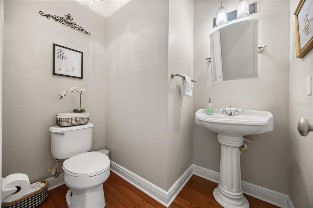 815 Spring Park Loop Celebration, FL 34747 - Photo 28 of 51 a bathroom with a sink toilet and a mirror