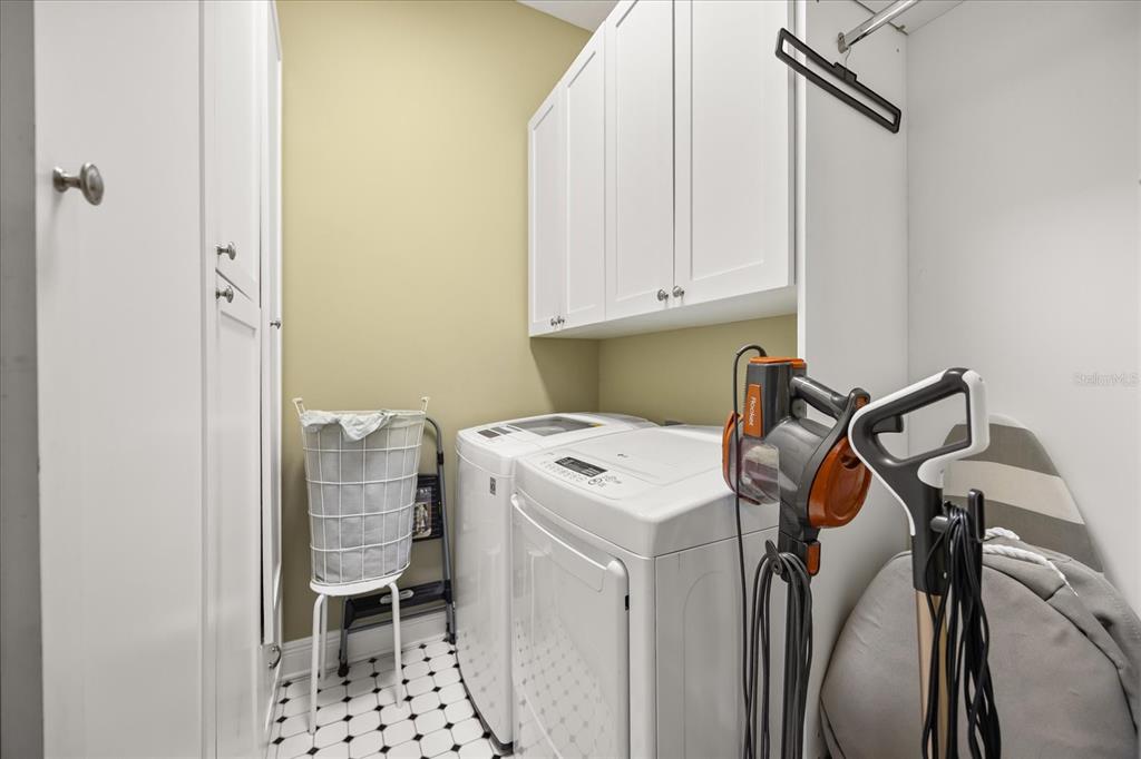 815 Spring Park Loop Celebration, FL 34747 - Photo 29 of 51 a utility room with dryer and washer