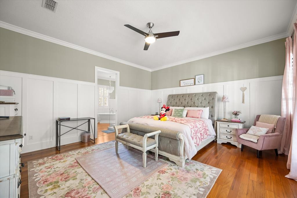 815 Spring Park Loop Celebration, FL 34747 - Photo 30 of 51 a bedroom with a bed and a table