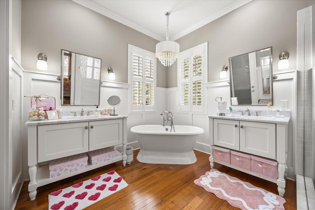 815 Spring Park Loop Celebration, FL 34747 - Photo 32 of 51 a spacious bathroom with a double vanity sink mirror and toilet