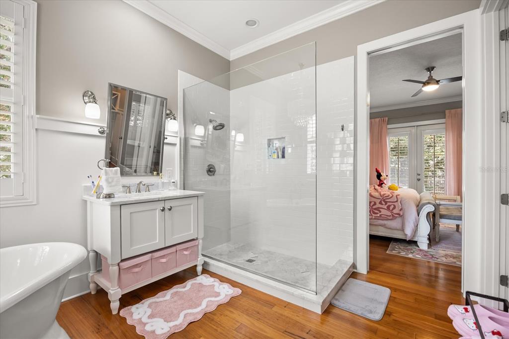 815 Spring Park Loop Celebration, FL 34747 - Photo 33 of 51 a bathroom with a double vanity sink toilet and shower