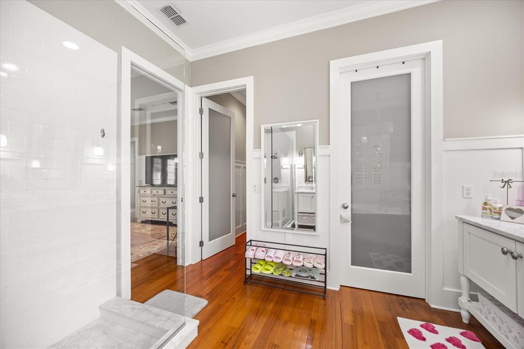 815 Spring Park Loop Celebration, FL 34747 - Photo 34 of 51 a very nice looking room with wooden floor and a bathroom