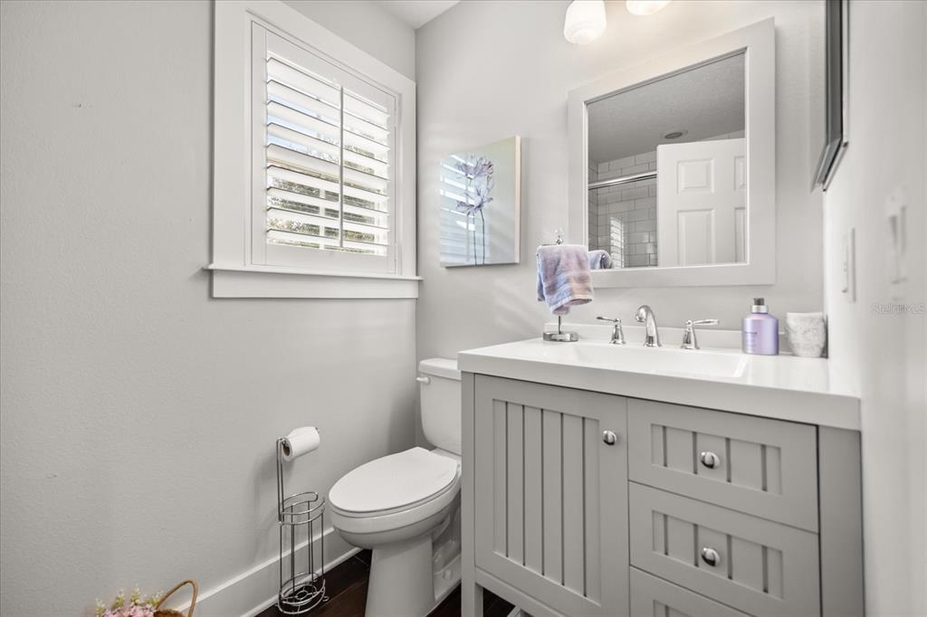 815 Spring Park Loop Celebration, FL 34747 - Photo 39 of 51 a bathroom with a sink a toilet and a window