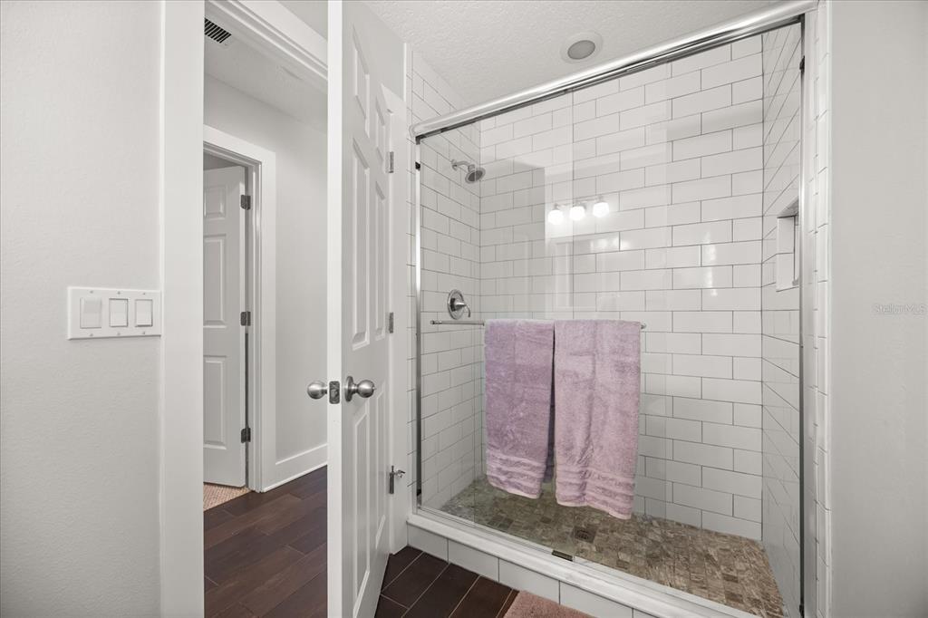 815 Spring Park Loop Celebration, FL 34747 - Photo 40 of 51 a bathroom with a shower and a sink