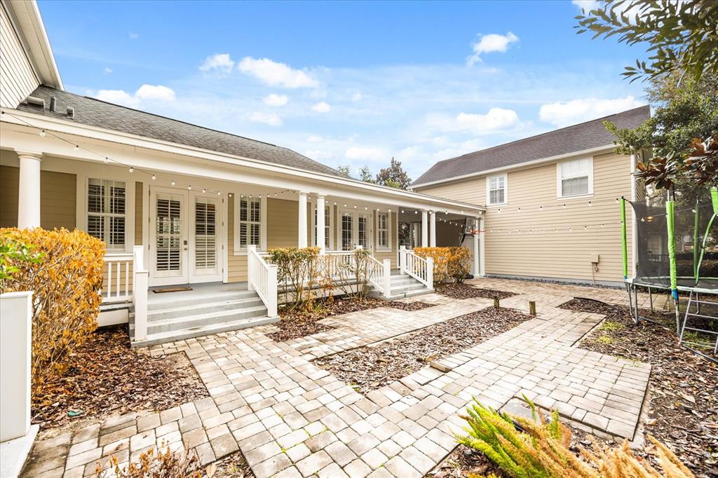 815 Spring Park Loop Celebration, FL 34747 - Photo 47 of 51 a front view of a house with a lounge chair