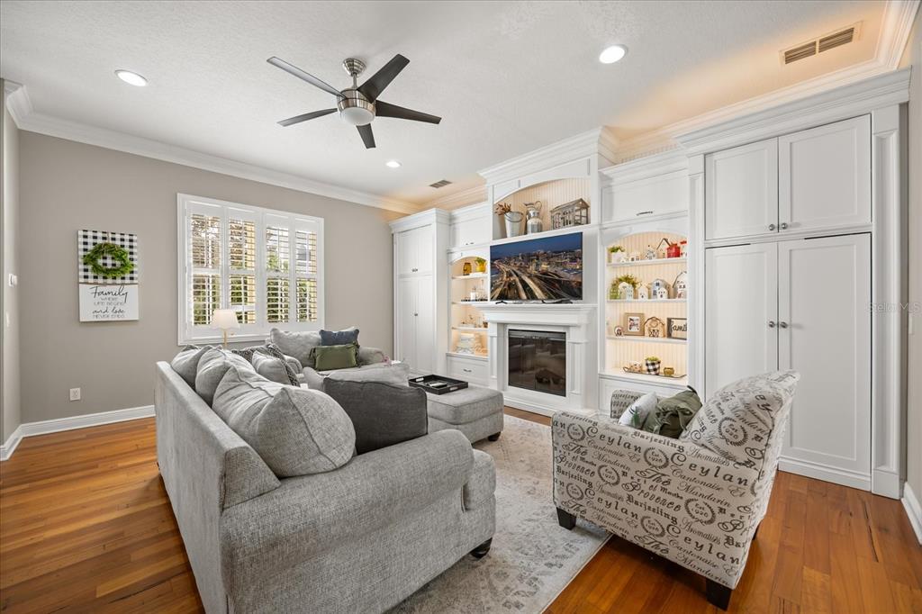 815 Spring Park Loop Celebration, FL 34747 - Photo 8 of 51 a living room with furniture fireplace and a window