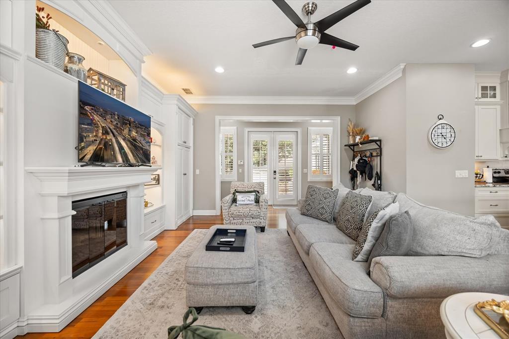 815 Spring Park Loop Celebration, FL 34747 - Photo 9 of 51 a living room with furniture a fireplace and a flat screen tv