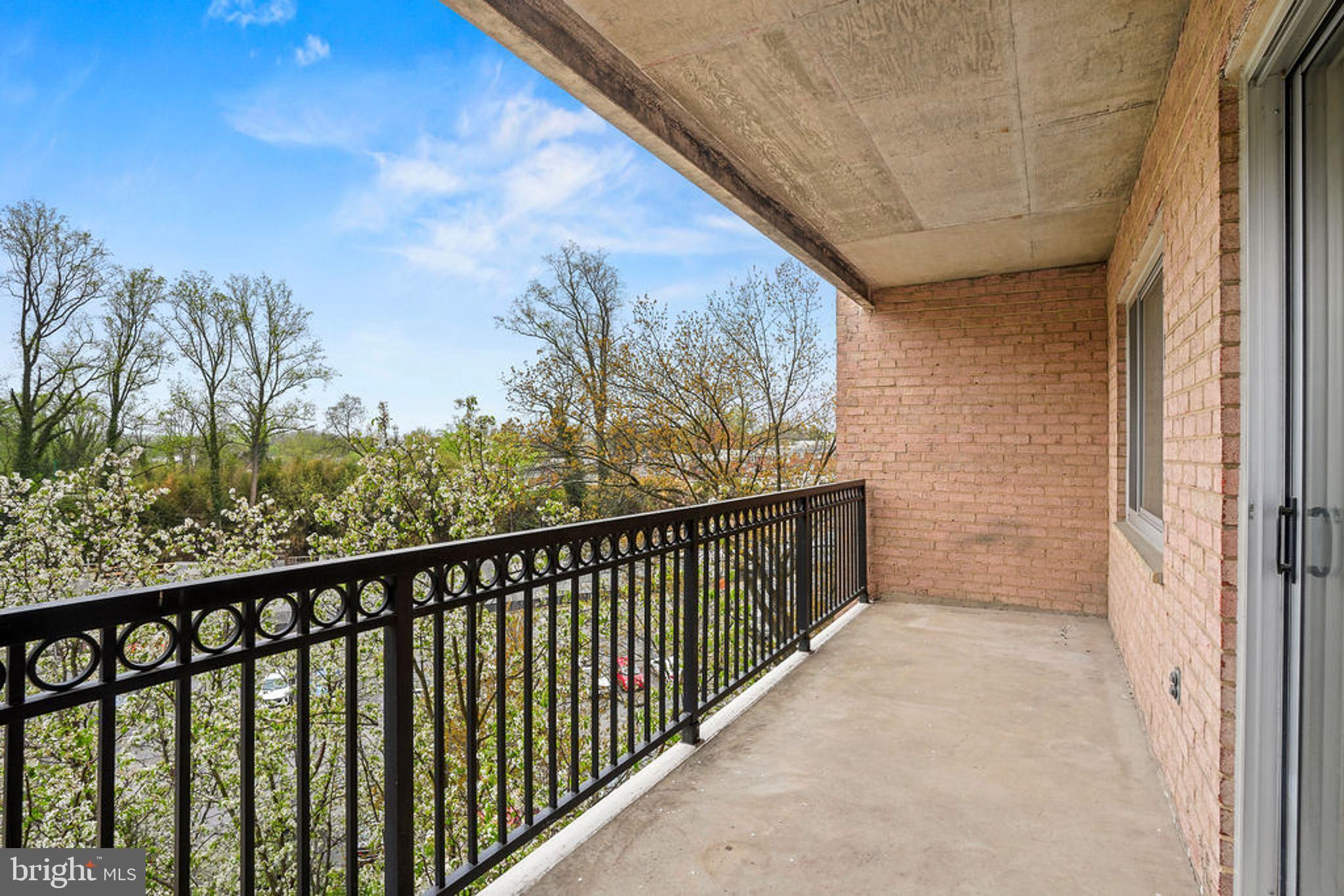 1900 Lyttonsville Road, Unit 612 Silver Spring, MD 20910 - Photo 17 of 23 a view of a balcony with an outdoor space
