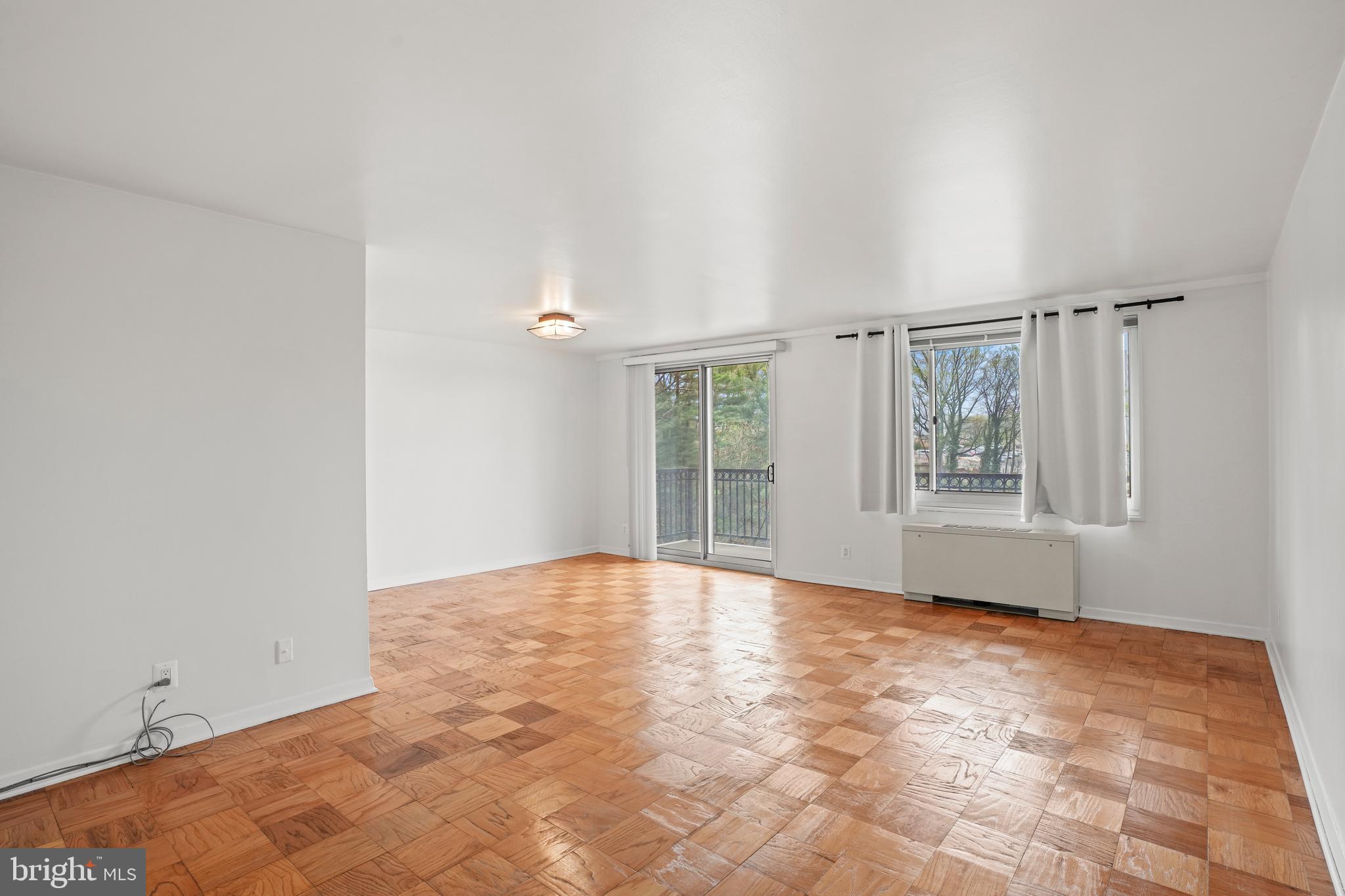 1900 Lyttonsville Road, Unit 612 Silver Spring, MD 20910 - Photo 7 of 23 a view of an empty room with a window