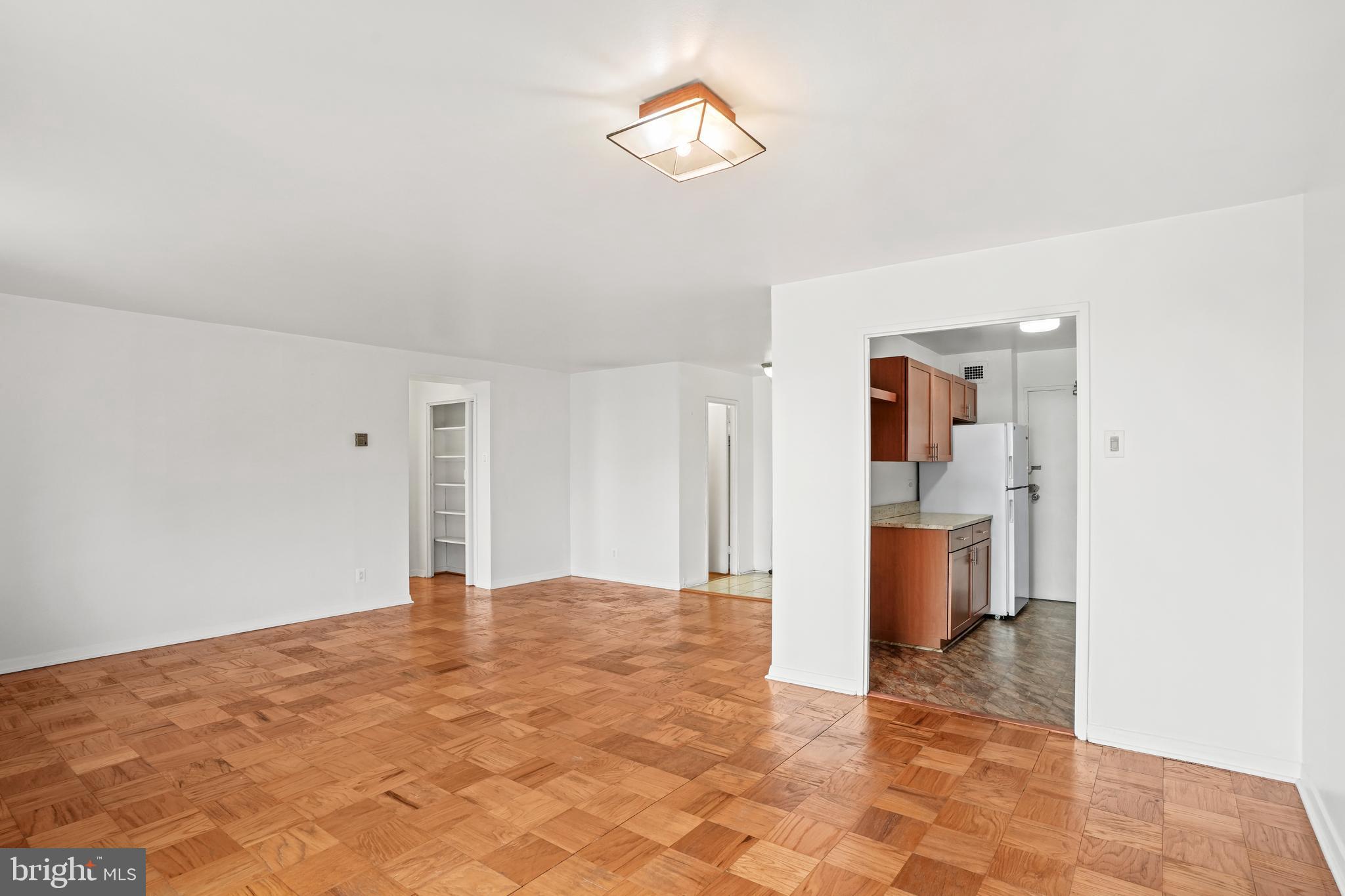 1900 Lyttonsville Road, Unit 612 Silver Spring, MD 20910 - Photo 8 of 23 a view of a room with a stylish ceiling fan and entryway