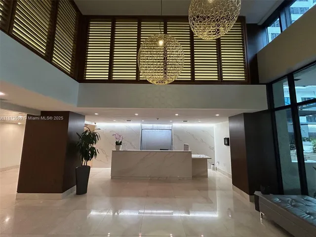 a view of a hallway with stairs