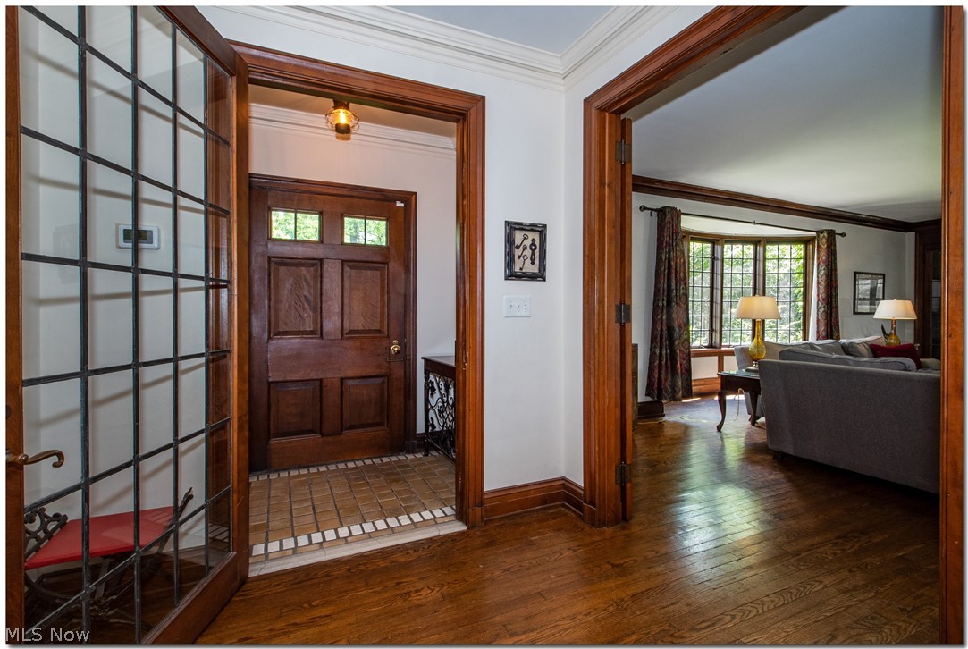 2820 Paxton Road Cleveland, OH 44120 - Photo 2 of 34 The welcoming foyer has gorgeous woodwork and a neutral tiled floor.