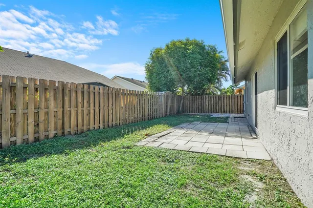 a view of backyard with green space