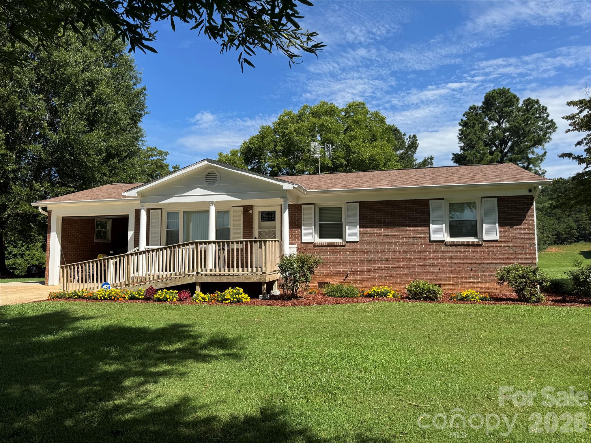 5107 Anderson Mountain Road Maiden, NC 28650 - Photo 2 of 27 a front view of a house with a yard and porch