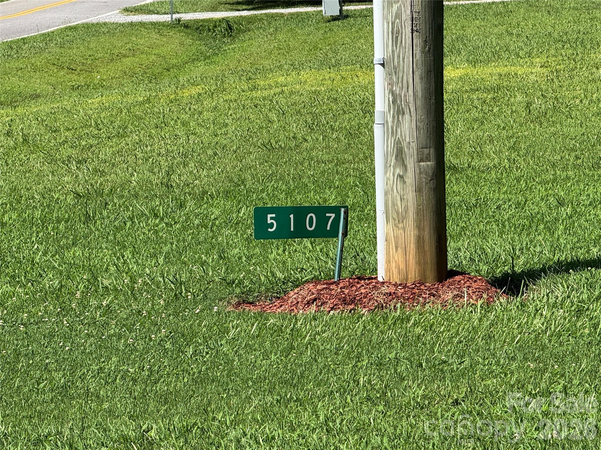 5107 Anderson Mountain Road Maiden, NC 28650 - Photo 27 of 27 a view of a backyard with potted plants
