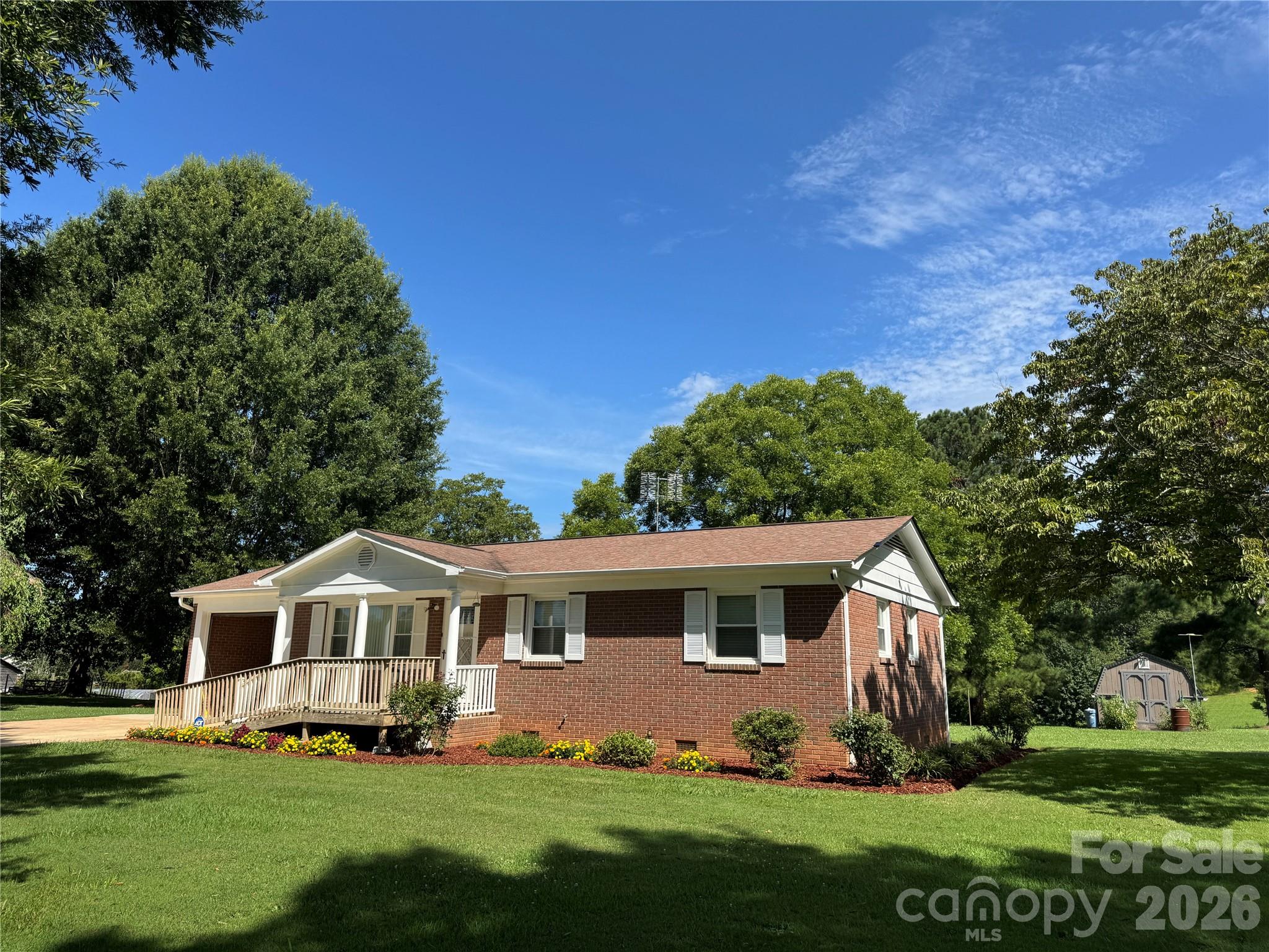 5107 Anderson Mountain Road Maiden, NC 28650 - Photo 3 of 27 a front view of a house with a garden