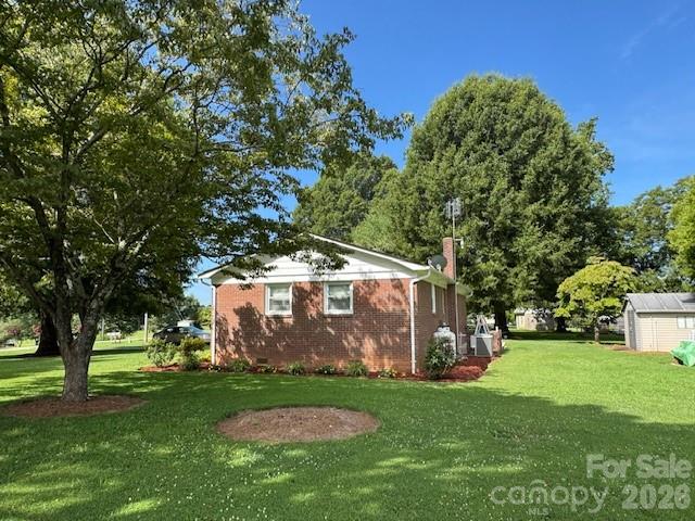5107 Anderson Mountain Road Maiden, NC 28650 - Photo 4 of 27 a view of a backyard with large trees