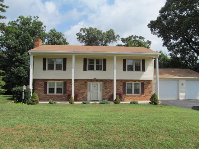 138 Timberline Drive Blue Ridge, VA 24064 - Photo 1 of 32 a front view of a house with garden