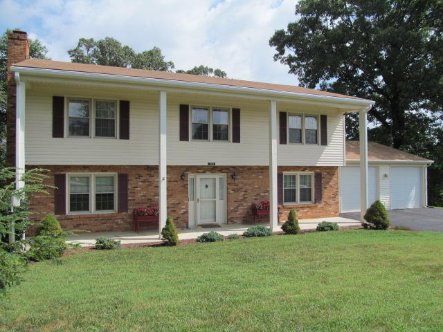 138 Timberline Drive Blue Ridge, VA 24064 - Photo 2 of 32 a view of a house with a backyard