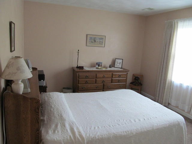 138 Timberline Drive Blue Ridge, VA 24064 - Photo 16 of 32 a bedroom with a bed and a window