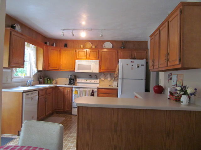 138 Timberline Drive Blue Ridge, VA 24064 - Photo 20 of 32 a kitchen with stainless steel appliances a refrigerator a sink a stove and white cabinets