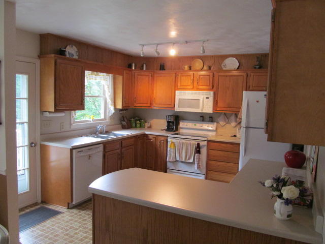 138 Timberline Drive Blue Ridge, VA 24064 - Photo 21 of 32 a kitchen with stainless steel appliances granite countertop a sink a stove and a refrigerator