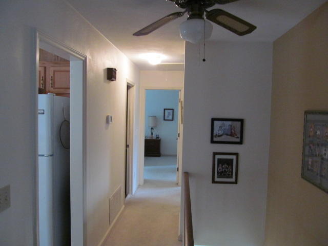 138 Timberline Drive Blue Ridge, VA 24064 - Photo 24 of 32 a view of a hallway with closet and a chandelier fan